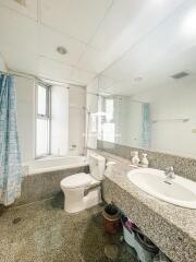 Bright and clean bathroom interior with shower and large mirror