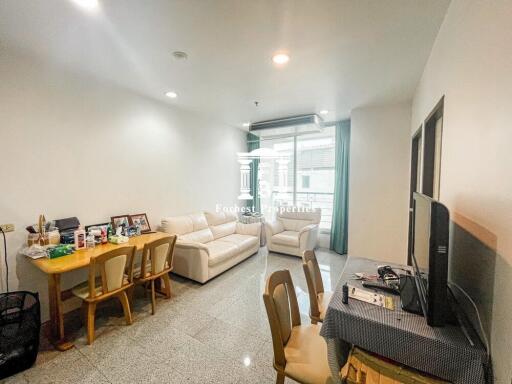 Spacious and well-lit living room with dining area