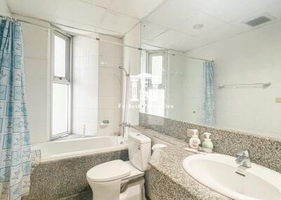 Spacious bathroom with natural light and modern amenities