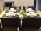 Elegantly set table in a modern kitchen with appliances