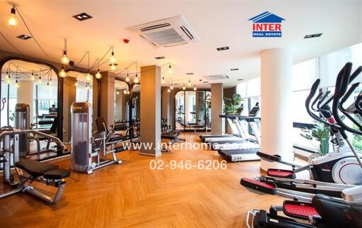 Spacious modern gym in residential building with various exercise equipment