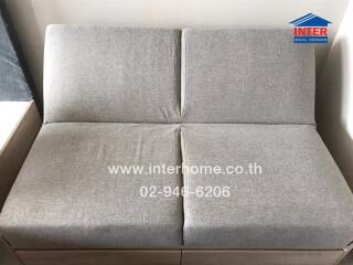 Grey fabric sofa in a modern living room setting