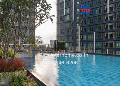 Luxurious apartment building with an outdoor pool and garden area