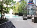 Luxurious outdoor pool area with stylish seating and lush greenery
