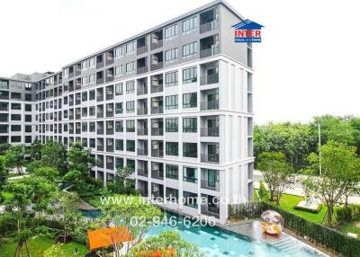 Modern residential apartment building surrounded by greenery