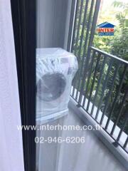 Balcony view showing a new air conditioning unit wrapped in plastic