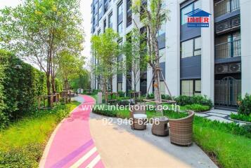 Modern apartment building exterior with landscaped walkway
