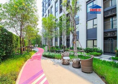 Modern apartment building exterior with landscaped walkway