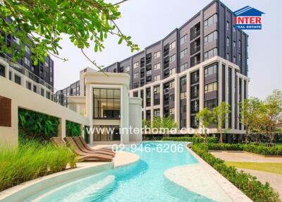 Modern residential building with landscaped swimming pool