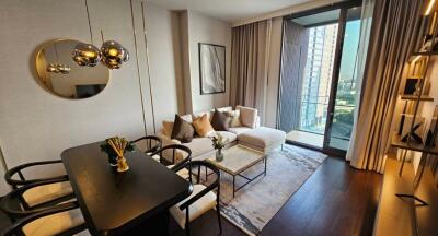 Modern living room with dining area and balcony access in an urban apartment