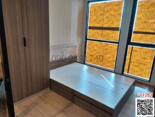 Modern bedroom with unique yellow window panels and wooden accents