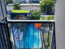 View from apartment balcony overlooking the swimming pool