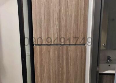 View of a modern wooden door entrance in an apartment