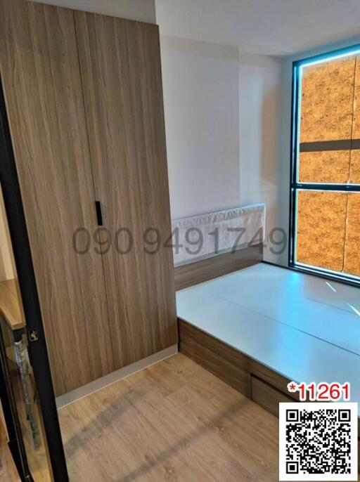 Modern bedroom with wooden wardrobe and comfortable low bed
