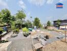 Outdoor garden area with scattered plants and seating, potential for landscaping in residential property