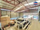 Spacious warehouse interior with storage and machinery