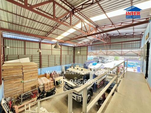 Spacious warehouse interior with storage and machinery