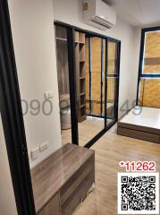 Modern bedroom with sliding glass doors and air conditioning