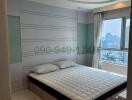 Spacious master bedroom with city view