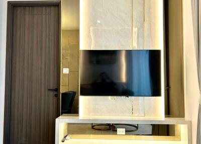 Modern living room with wall-mounted TV and elegant design