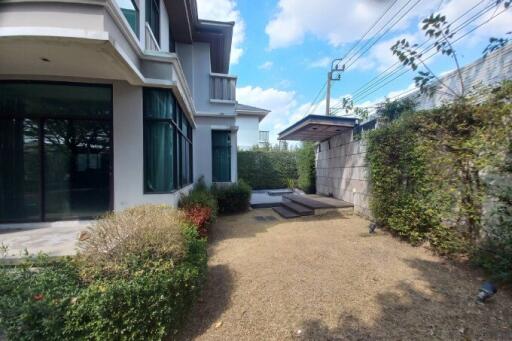 Modern residential home exterior with garden