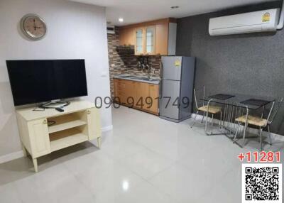 Spacious combined living room and kitchen with modern amenities