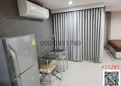 Spacious modern bedroom with air conditioning and ample lighting