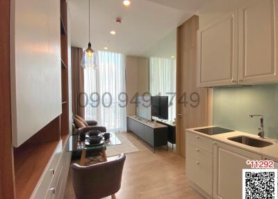 Compact studio apartment with integrated living, kitchen, and dining area