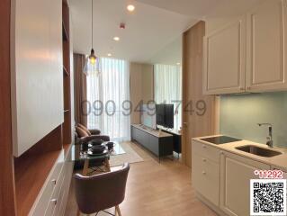 Compact studio apartment with integrated living, kitchen, and dining area