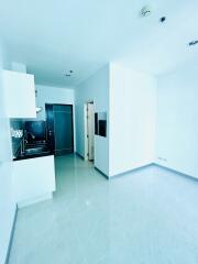 Modern, well-lit kitchen with integrated appliances