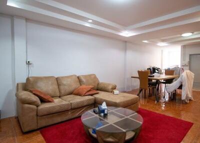 Spacious living room with comfortable seating and dining area