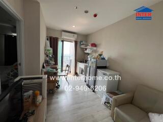 Spacious living room with natural light and balcony access