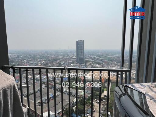 Panoramic city view from high-rise balcony