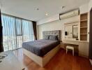 Spacious bedroom with modern design and city view