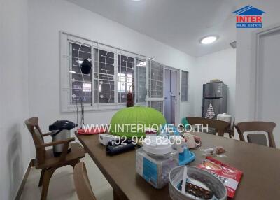Spacious kitchen with dining area and large windows