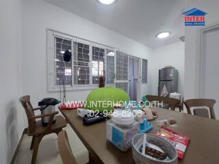 Spacious kitchen with dining area and large windows