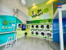 Bright and colorful laundry room with multiple washing machines