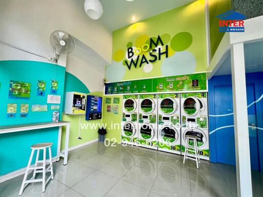 Bright and colorful laundry room with multiple washing machines