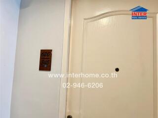 Apartment door number 620 with Inter Real Estate sign