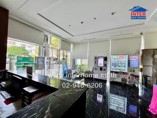 Spacious and modern lobby area with large windows and glossy floors