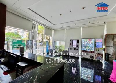Spacious and modern lobby area with large windows and glossy floors