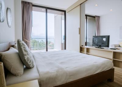 Spacious bedroom with scenic view and modern amenities