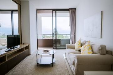 Modern living room with balcony access and panoramic view