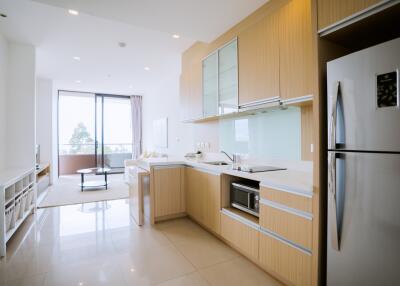 Modern kitchen with an open-plan layout extending to a balcony