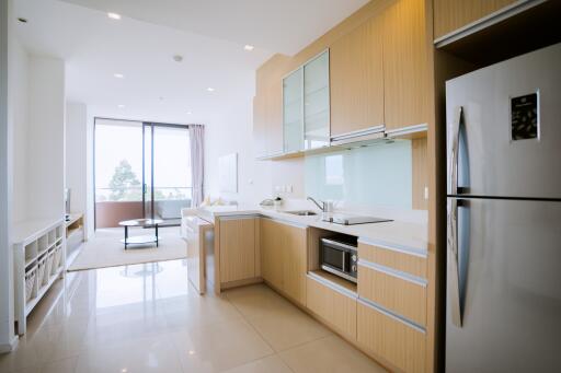 Modern kitchen with an open-plan layout extending to a balcony