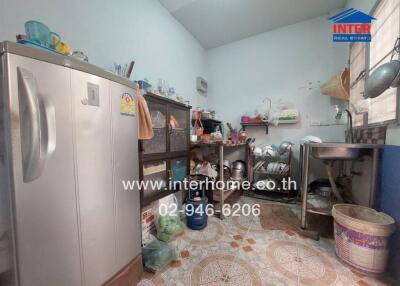 Spacious kitchen with appliances and tile flooring