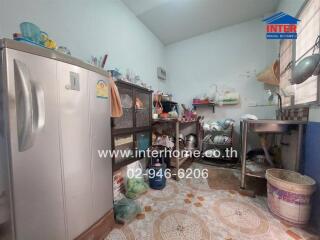 Spacious kitchen with appliances and tile flooring