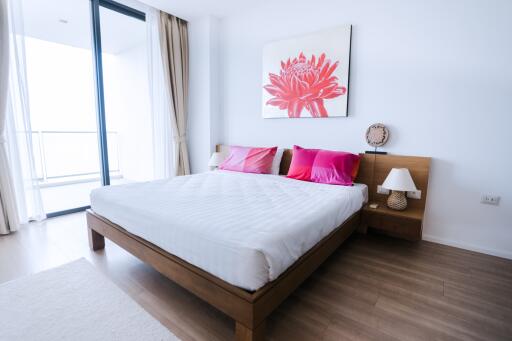 Bright and inviting bedroom with wooden bed frame and modern decor