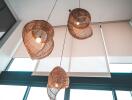 Modern wicker pendant lights in a high ceiling room