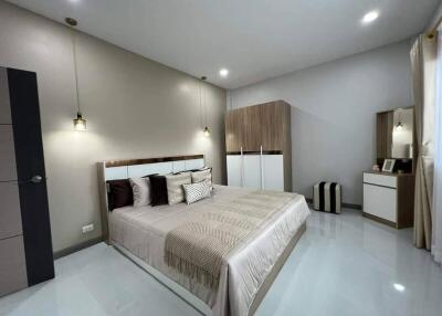 Modern and elegantly furnished bedroom with neutral color scheme